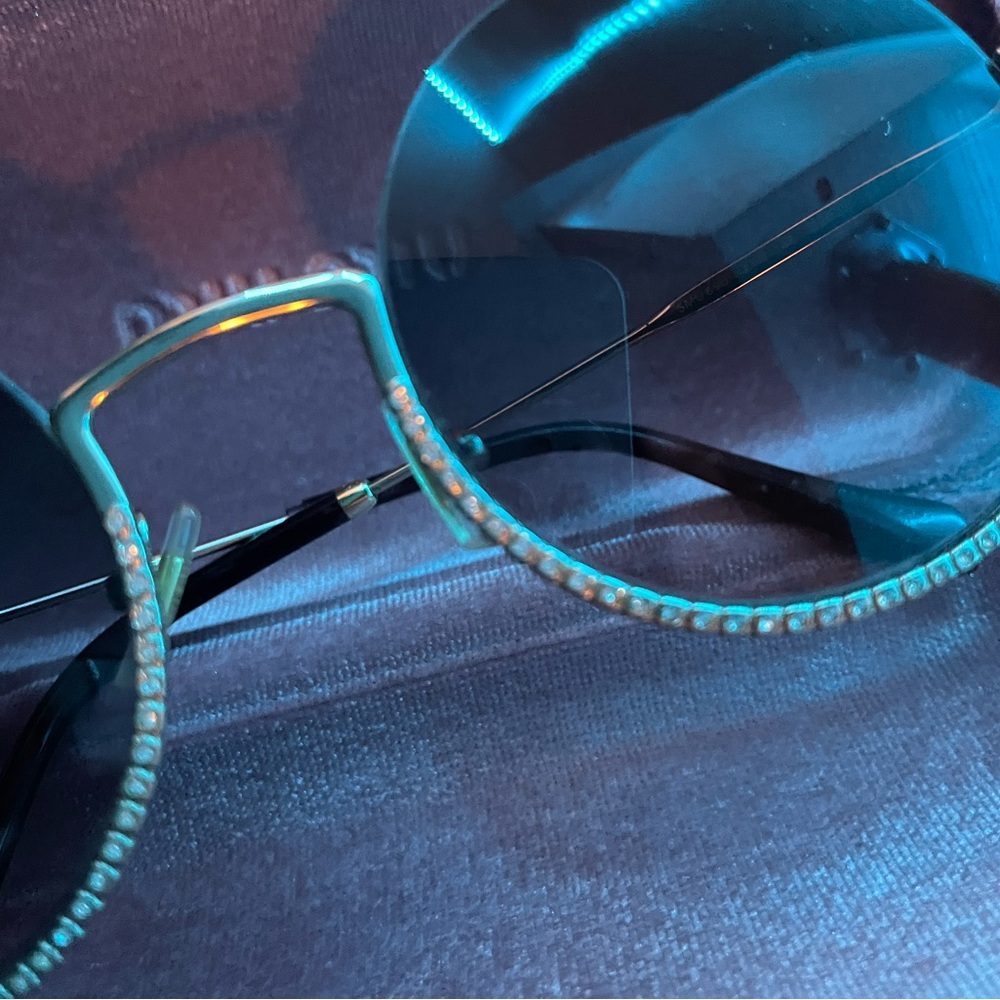 Miu Miu Sunglasses with Black and Gold Accents